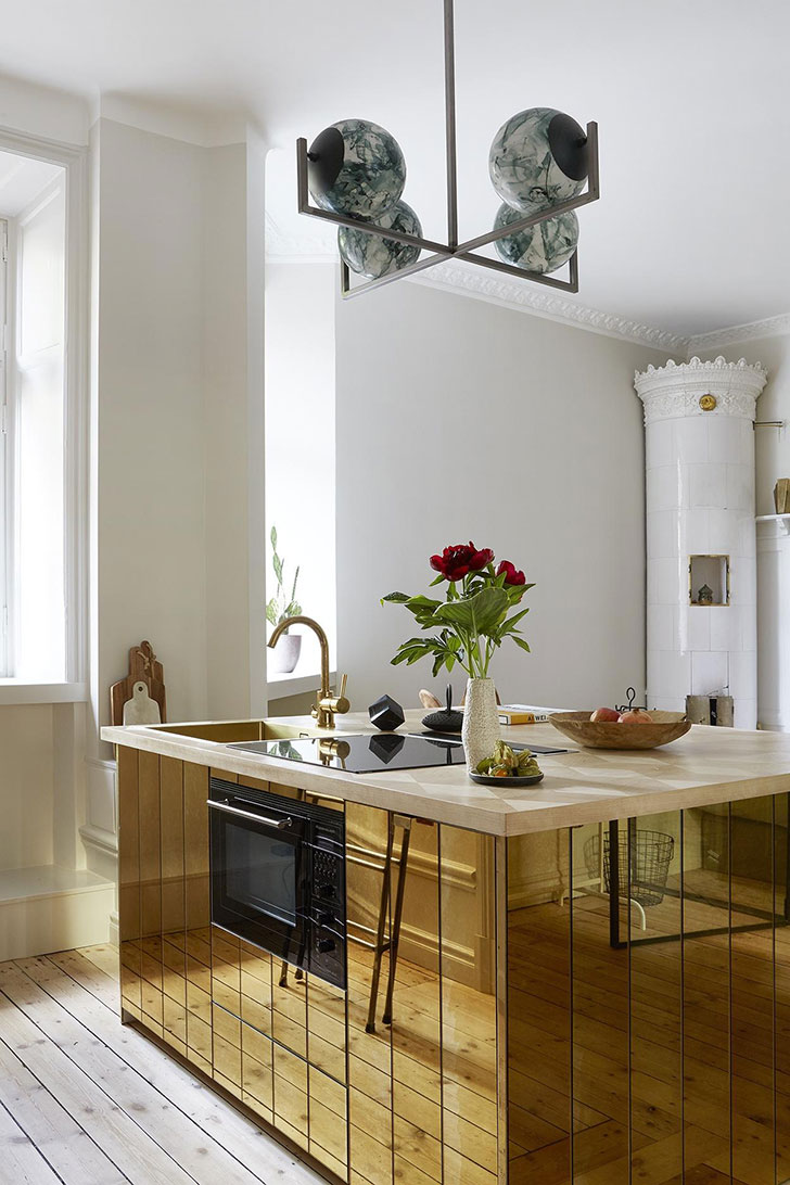 Small apartment  with gold kitchen  island  in Stockholm 37 