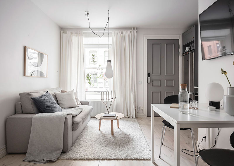 Приятная белая квартира с нежным декором и двумя входами в Гётеборге