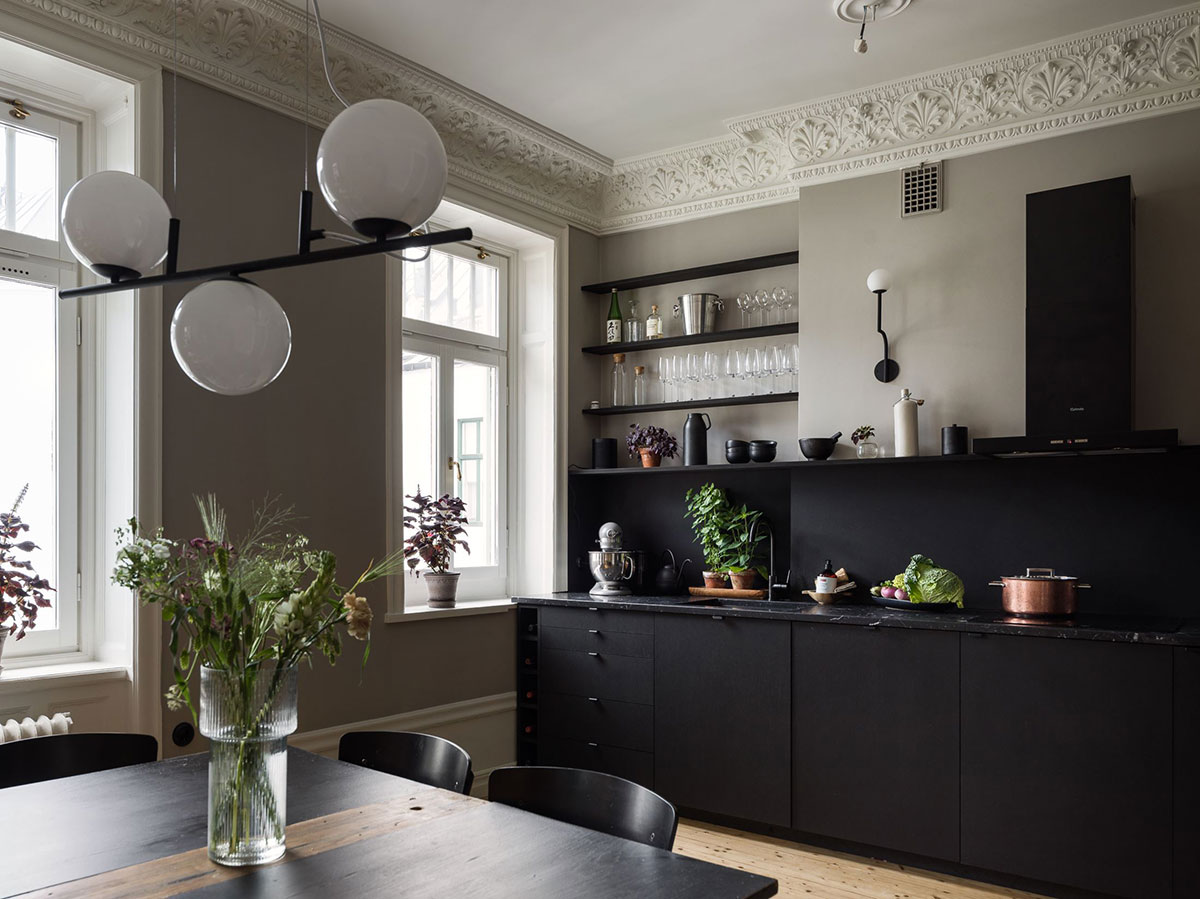 Beautiful black kitchen as the heart of small Swedish apartment ...